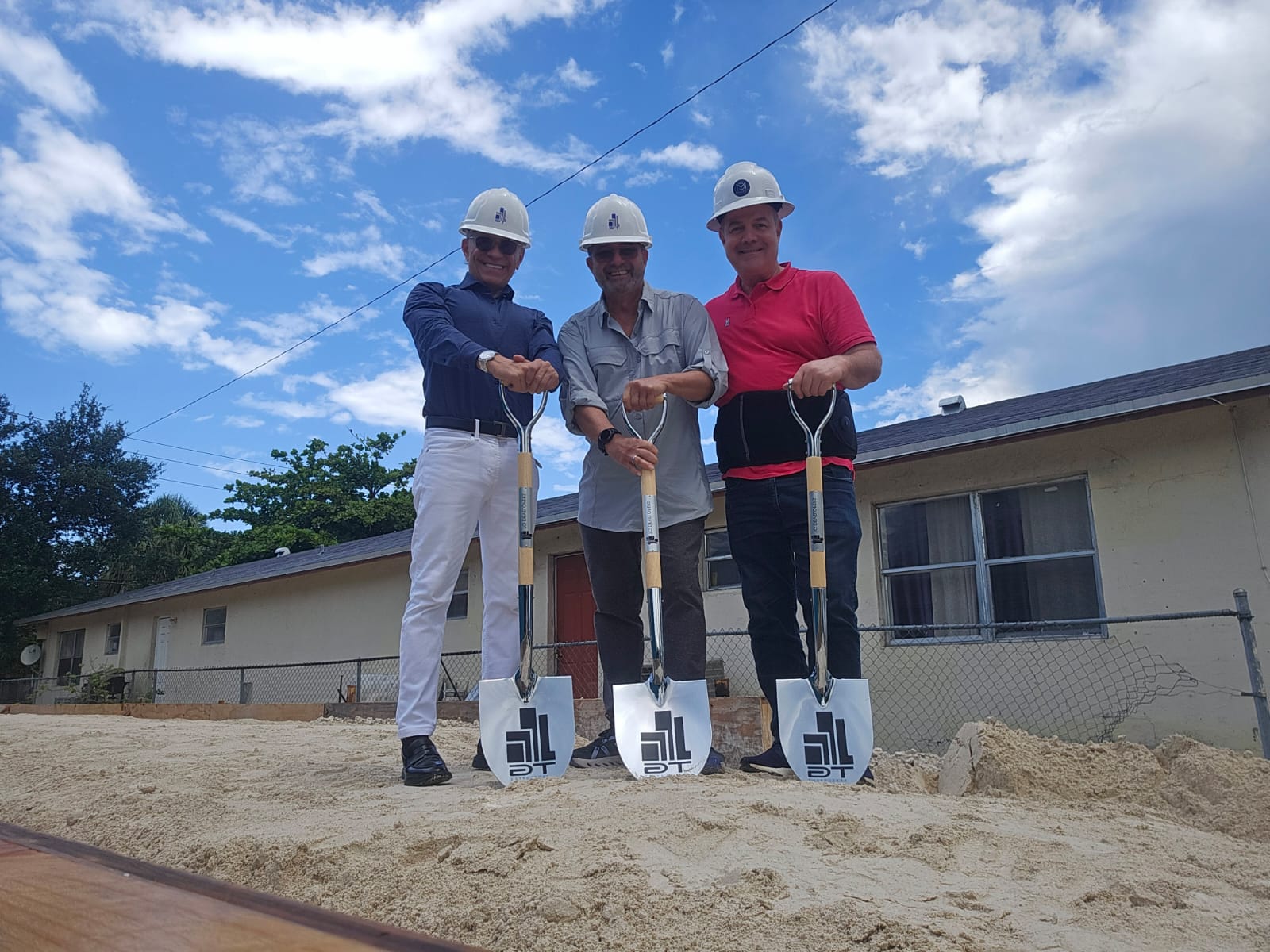 BCL Group1 team at the groundbreaking ceremony with hard hats and shovels