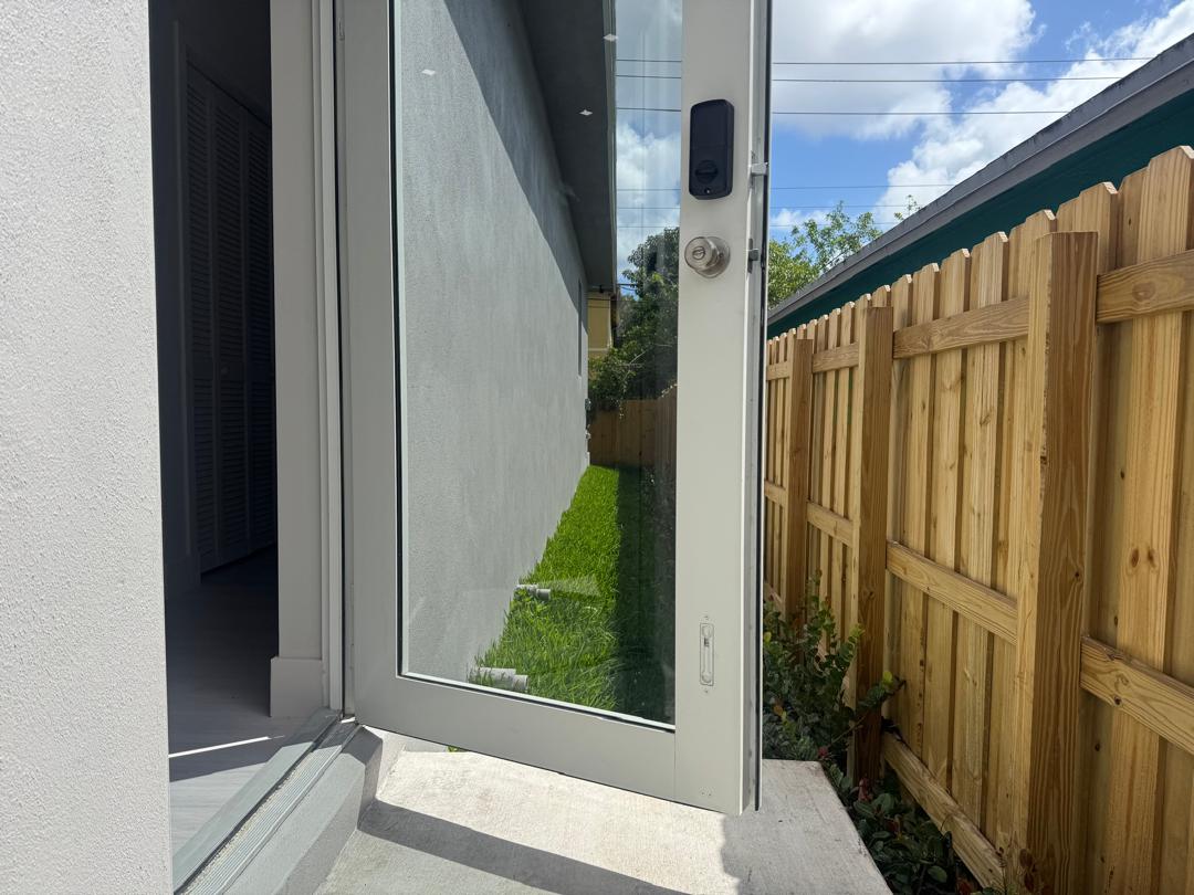 Finished glass door with access to the backyard and new perimeter fence